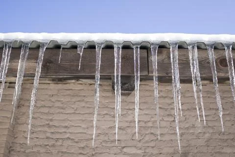 Icicles hanging in a row . winter concept Stock Photos