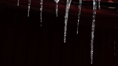 Icicles melting black background 库存影片 89975770