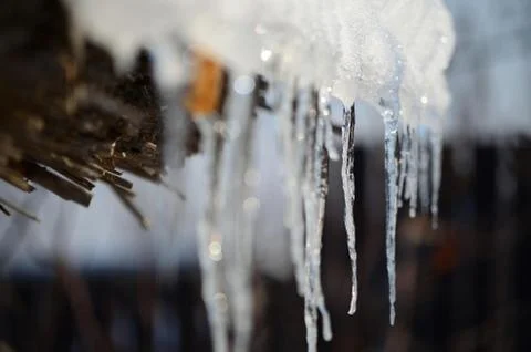 Icicles melting on sun in spring Stock Photos