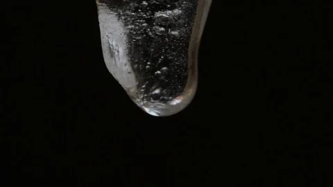 Icicles melts and drips on a black background Video stock 85324716
