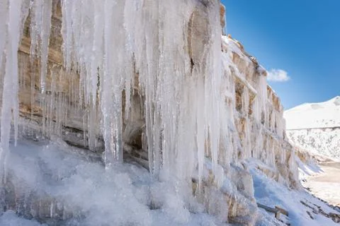 Icicles on a mountain side 스톡 사진