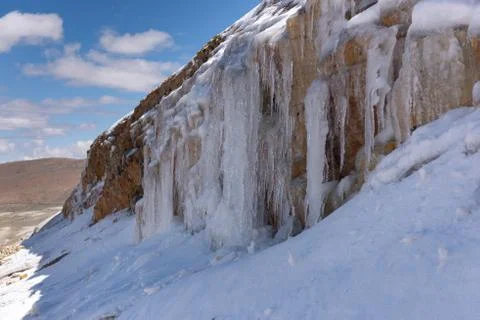 Icicles on a mountain side Stock Photos