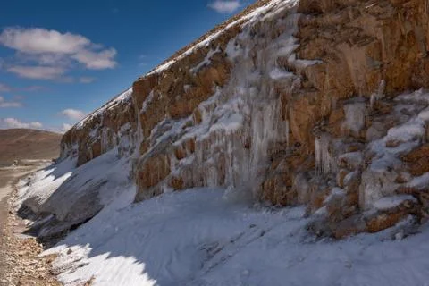 Icicles on a mountain side 스톡 사진