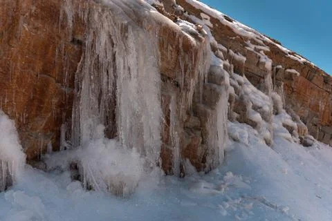 Icicles on a mountain side Stock Photos