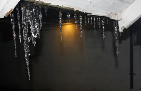 Icicles at night. Stock Photos