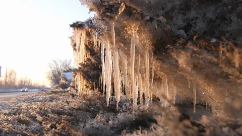 Icicles Reflecting the Sun's Rays. with Sound Stock Footage 98217754