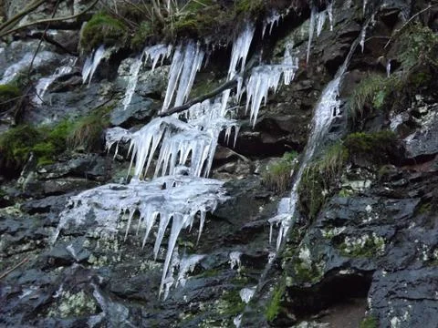 Icicles on a rock Stock Photos