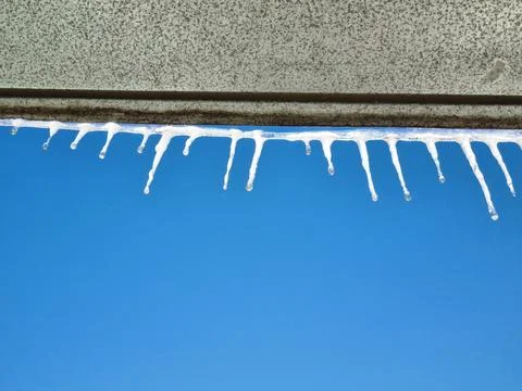 Icicles on the roof Stock Photos