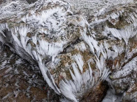 Icicles on stone due to wind Stock Photos