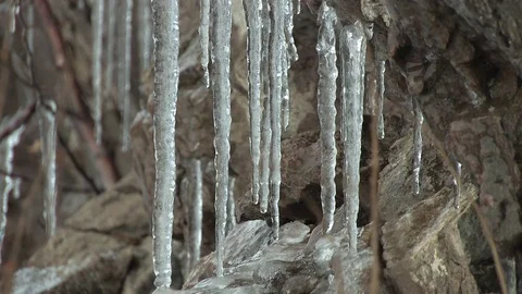 Icicles on stone Stock Footage 82940943