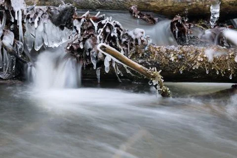 Icicles on the stream Stock Photos