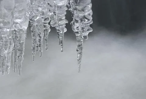 Icicles on the water.small depth of field. Stock Photos