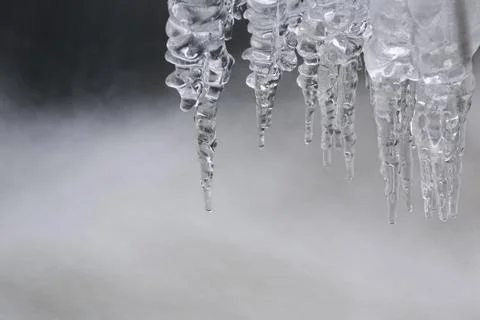 Icicles on the water.small depth of field. Stock Photos