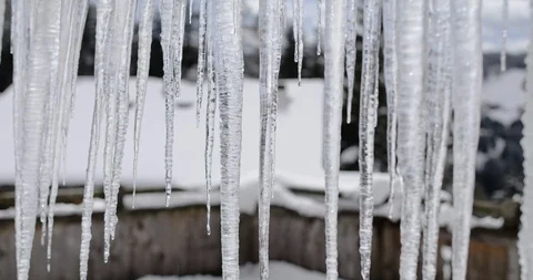 Icicles in winter dripping. Winter scene in 4K Stock Footage 127191601