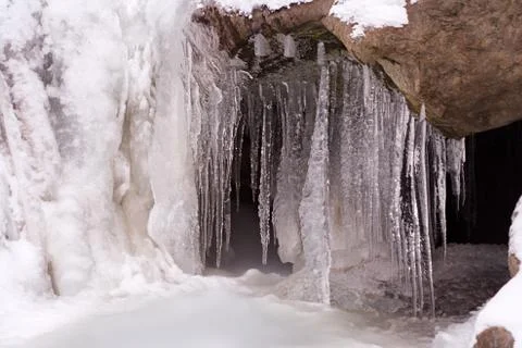 Icicles in a winter mountain stream in Austria. Stock Photos