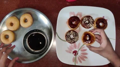 Icing on doughnuts Stock Footage 211723364