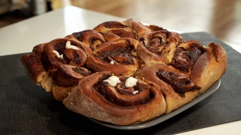 Icing Fresh cinnamon rolls Stock Footage 145026225