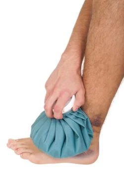 Icing a sprained ankle Stock Photos