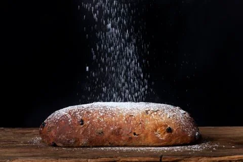 Icing sugar falling on a dresdner stollen Stock Photos
