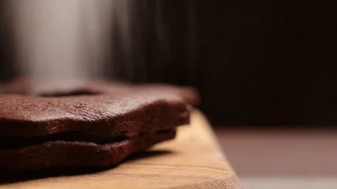 Icing sugar falls down on cookies Stock Footage 126973128