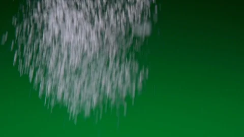 Icing sugar powder sprinkled using strainer on green gradient background Stockbeeldmateriaal 122868676