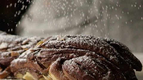 Icing sugar sprinkled onto cake on counter Stock Footage 274689134