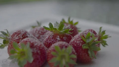 Icing sugar on strawberries Stock Footage 74080328