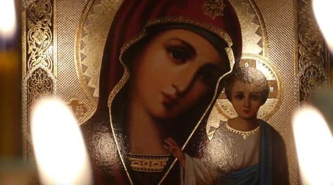 Icon Icon of the Virgin Mary with baby Jesus.Candles .1a Stock Footage