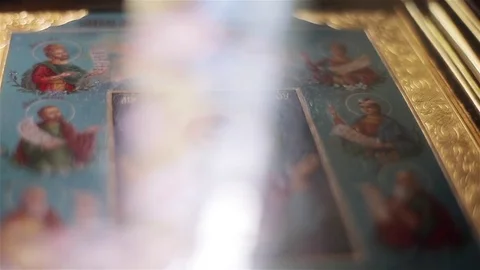 Icon image of Virgin Mary in St Nicholas Orthodox Cathedral macro close up light Stock Footage 79963233