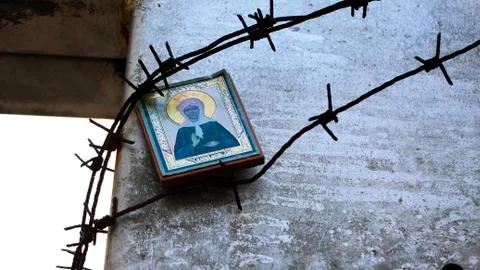 Icon under the barbed wire. Stock Photos