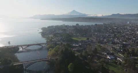 Iconic aerial shot showing the beautiful city of Villarrica and its bridge .. Stock Footage 289743053