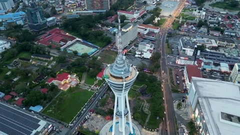 The iconic Alor Setar Tower rises above rooftops in aerial shot. Stock Footage 318101210