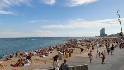 Iconic Barceloneta crowded beach and W Hotel panorama, Barcelona Stock Footage 102342280