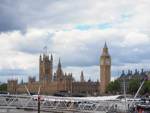 The iconic Big Ben clock tower and the Houses of Parliament framed by the Stock Photos