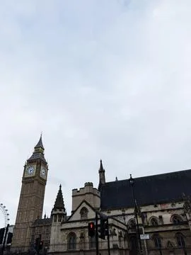 Iconic Big Ben clock tower and historic Houses of Parliament against overca.. Stock Photos