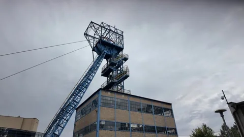 Iconic blue headframe of the historic Guido Mine in Zabrze, Poland Stock Footage 335877127
