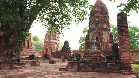 Iconic Buddha Statue at Ancient Brick Prang in Ayutthaya. Wat Mahathat Historic Stock Footage 312916650
