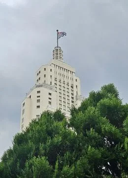 Iconic building under cloudy sky -- Farol Santander Stock Photos
