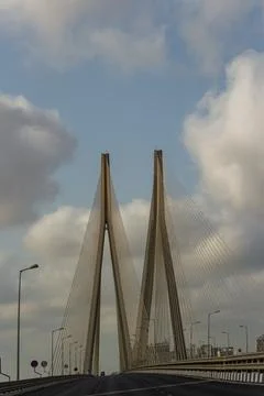 The iconic cable-stayed bridge supports soaring over the highway Stock Photos