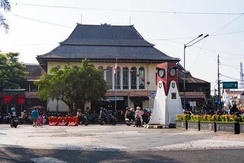 The iconic clock tower monument and traditional architecture of Pasar Gede. Stock Photos