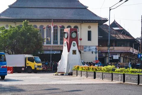 The iconic clock tower monument and traditional architecture of Pasar Gede. Stock Photos