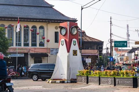 The iconic clock tower monument and traditional architecture of Pasar Gede. Stock Photos