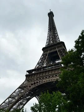 Iconic Eiffel Tower on a cloudy day in Paris, France Stock Photos