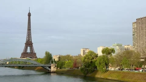 Iconic Eiffel Tower standing over the Seine river in Paris, France Stock Footage 336678192