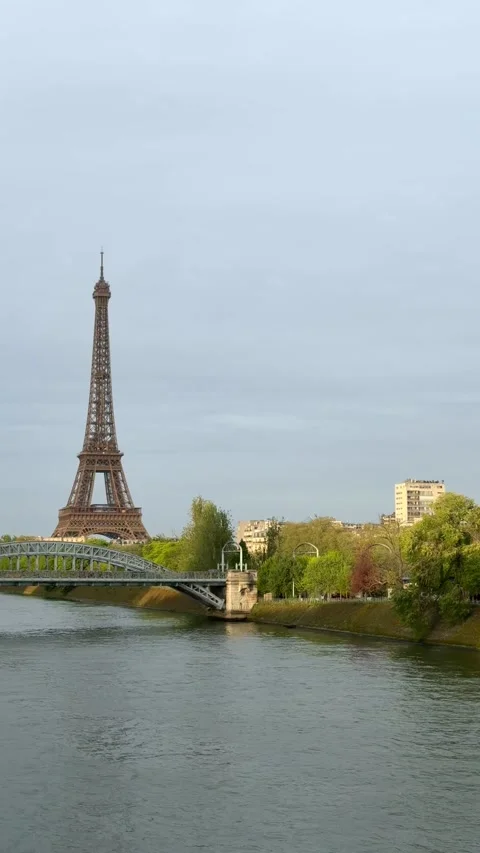 Iconic Eiffel Tower standing over the Seine river in Paris, France Stock Footage 337024728