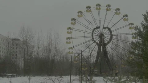 Iconic Ferris Wheel in the Abandoned Pripyat Amusement Park on a Cold Winter Day Stock Footage 321290701