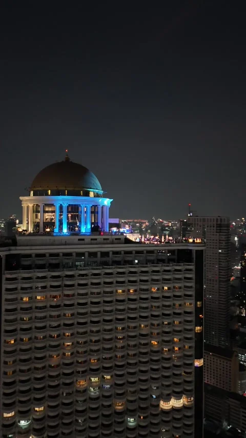 Iconic Golden Dome Rooftop Bar Overlooking Bangkok, Thailand at Night Stock Footage 335847951