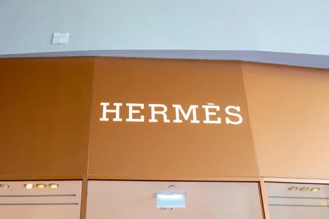 Iconic Hermes logo displayed on a store wall. Thailand, Bangkok Stock Photos