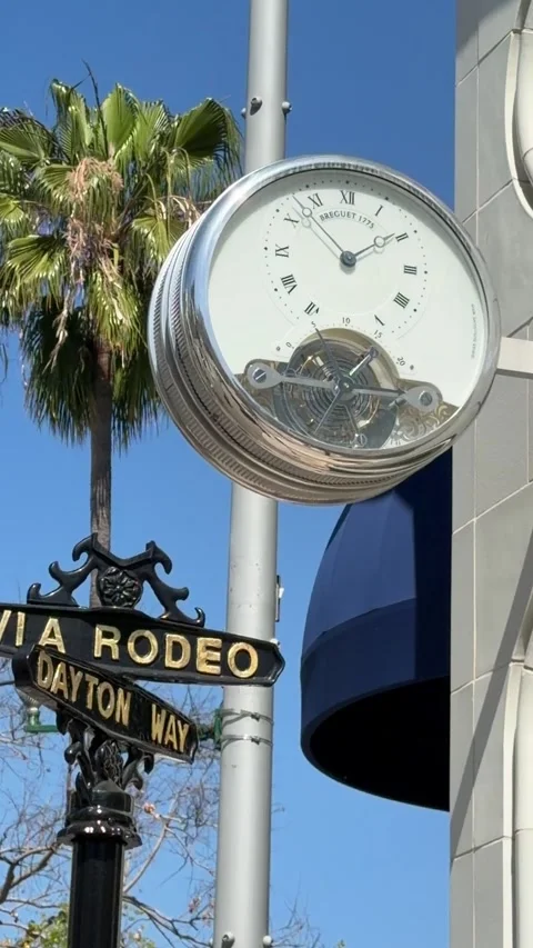 The iconic intersection sign and clock at Rodeo Drive and Dalton Way Stock Footage 337582394