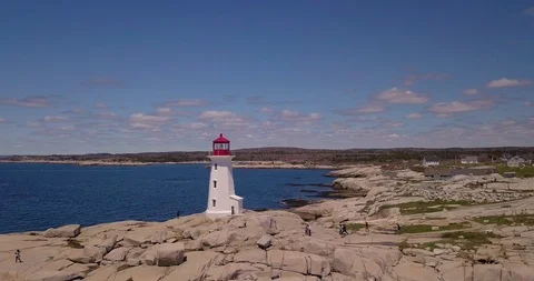 The iconic landmark of Peggy's Cove Lighthouse in Nova Scotia, Canada on a Stock Footage